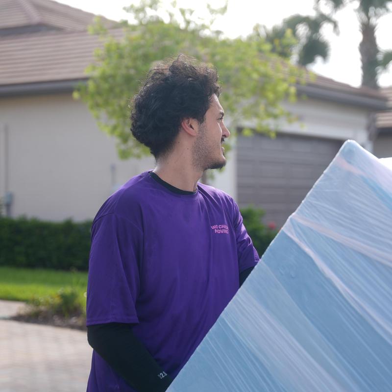 Mattress wrapped in protective moving wrap outdoors