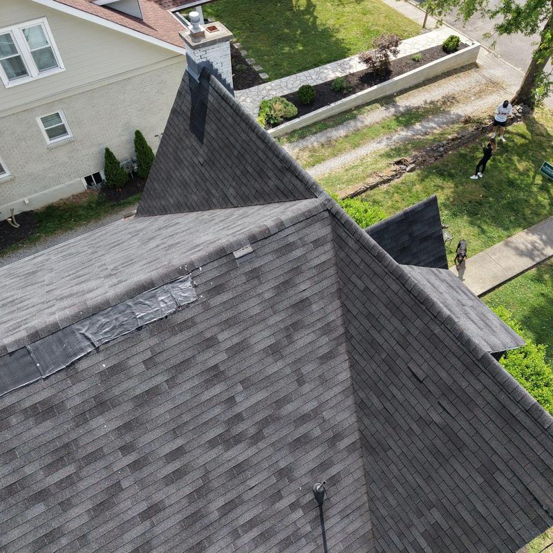 Asphalt shingle roof with temporary repair patch