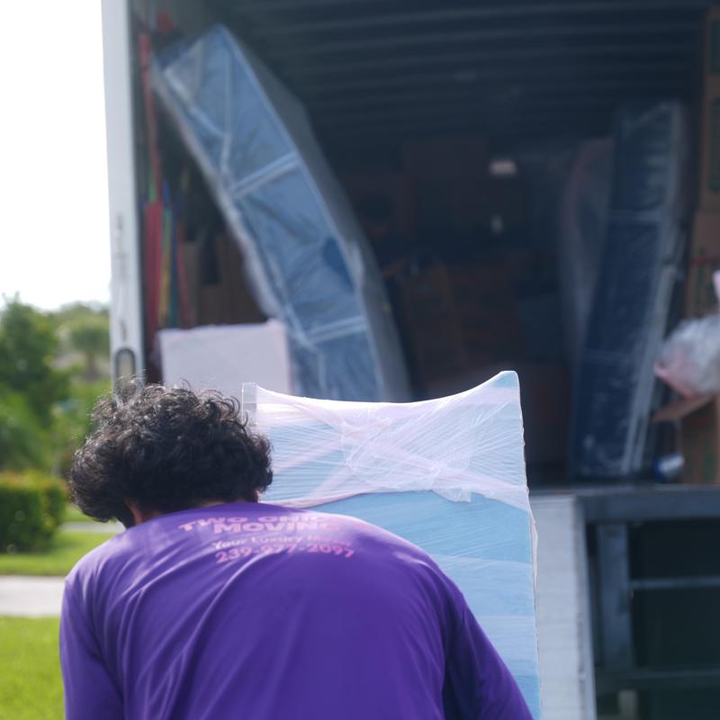 Mattresses wrapped and loaded in moving truck