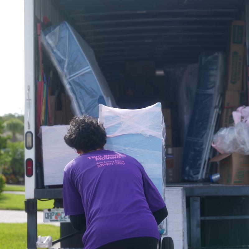Moving truck loading with wrapped furniture and boxes