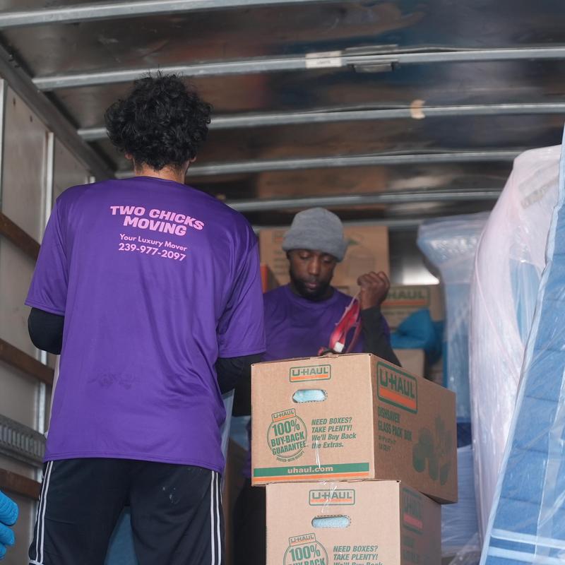 Moving boxes loading inside a moving truck