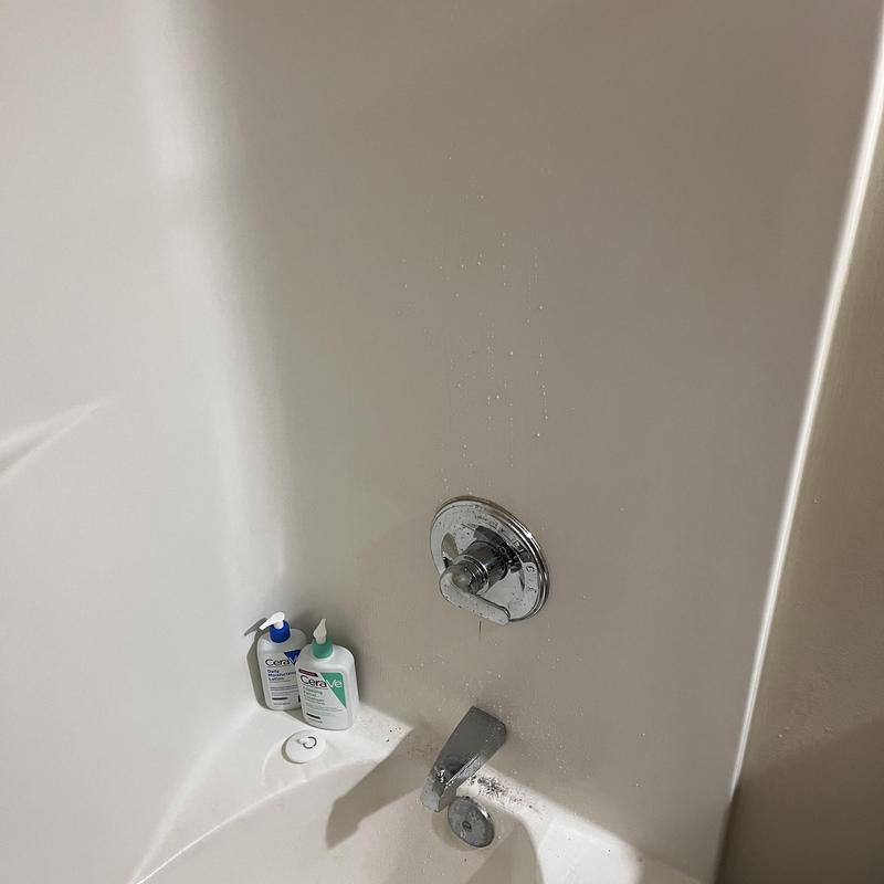 Shower valve and tub spout with water droplets Shower valve and tub spout with water droplets