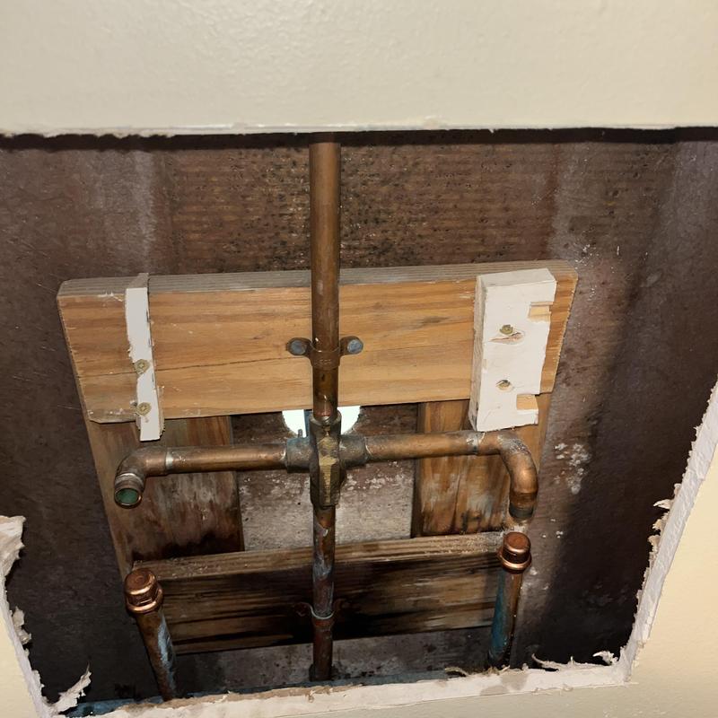 Copper water supply pipes with mounting board inside wall cavity Copper water supply pipes with mounting board inside wall cavity