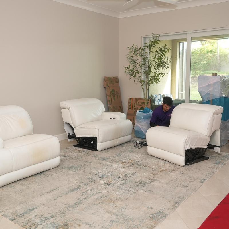 Leather recliner chairs arranged during moving service