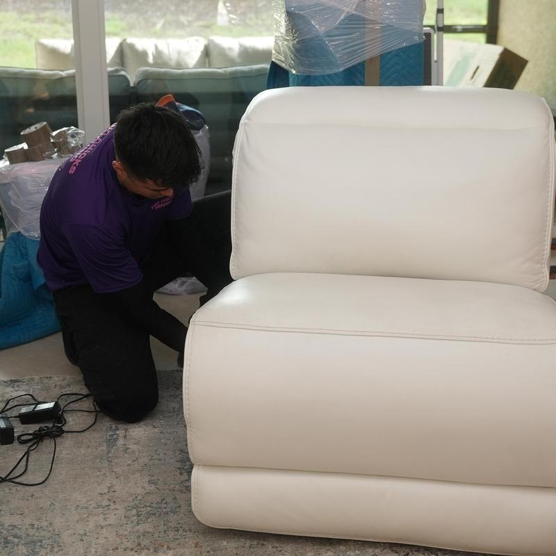White leather sectional sofa during moving service