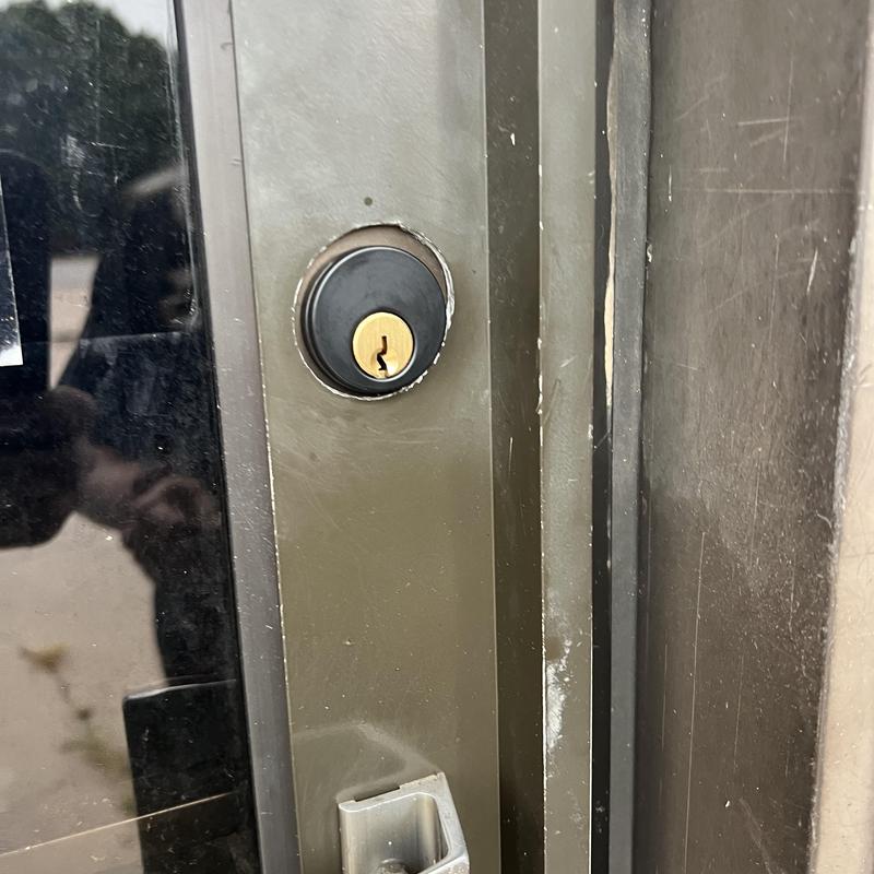 Mortise lock cylinder on metal door close-up