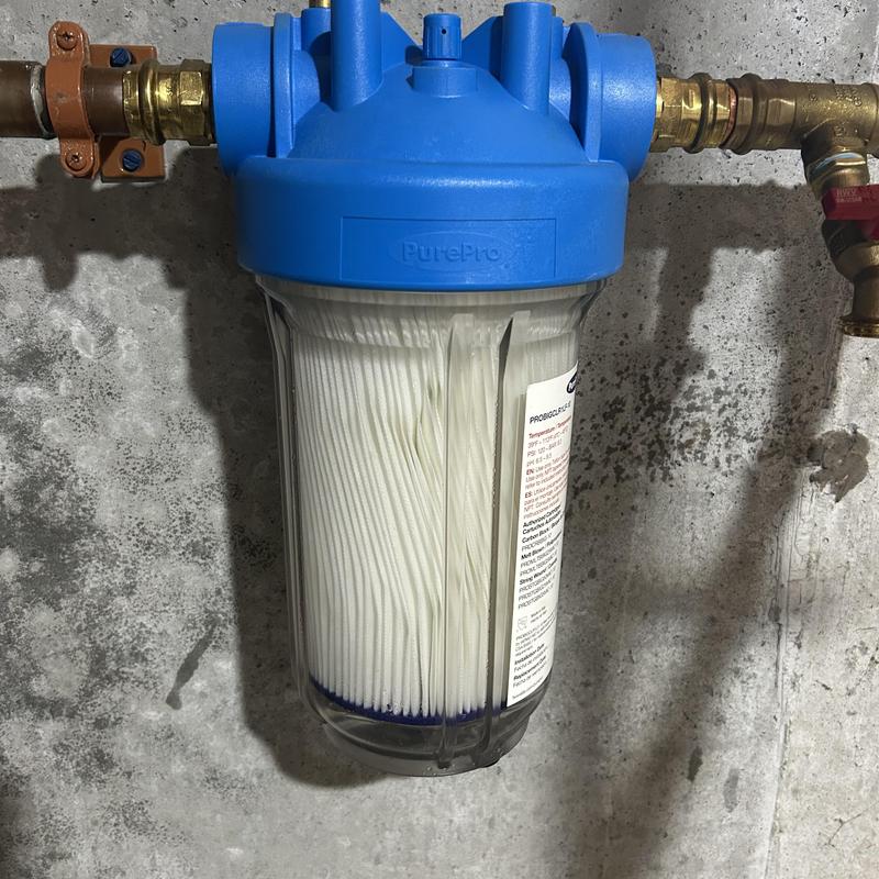 Whole house water filter in blue housing installed Whole house water filter in blue housing installed