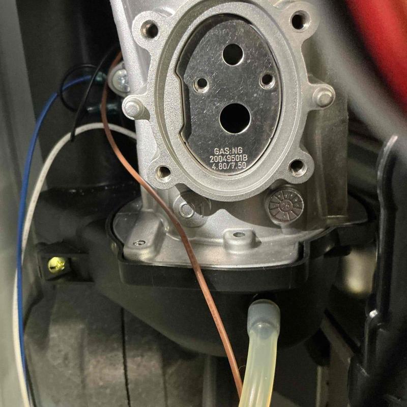 Tankless water heater gas conversion components close-up