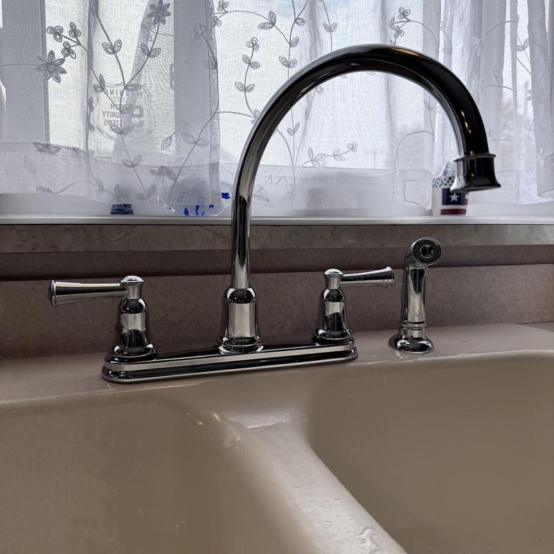 Kitchen faucet with sprayer and new handles Kitchen faucet with sprayer and new handles
