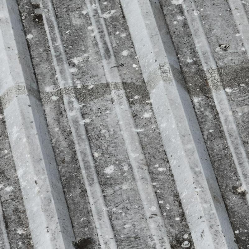 Metal roofing panels with hail damage and wear Metal roofing panels with hail damage and wear