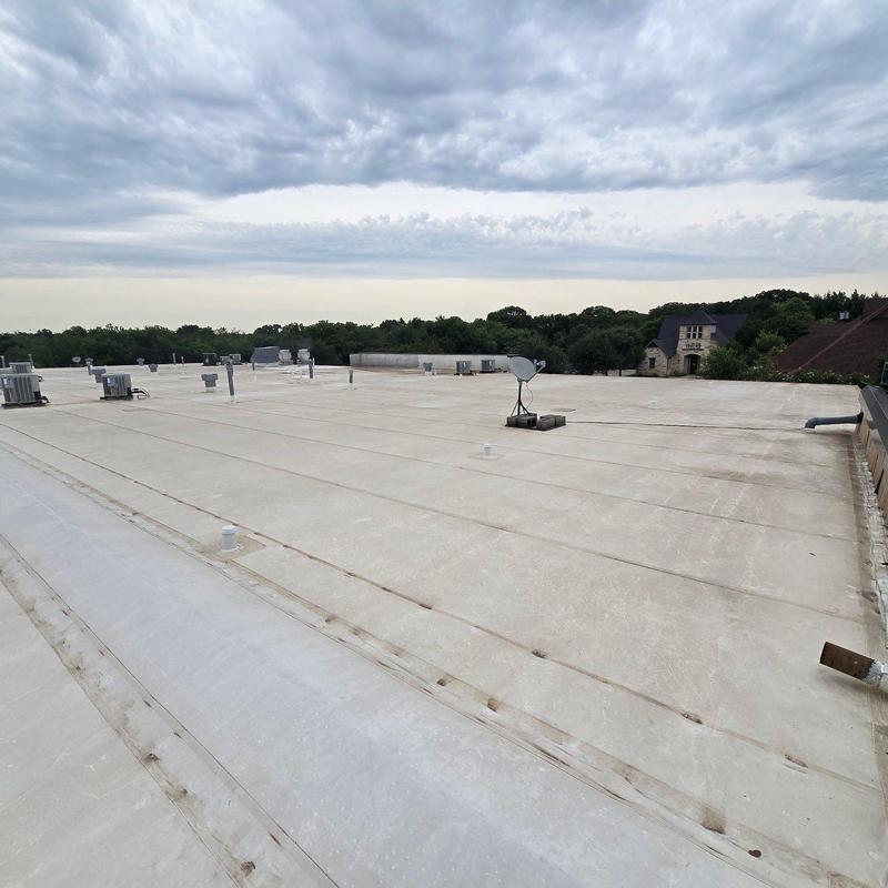 Concrete commercial roof with ventilation units and satellite dish Concrete commercial roof with ventilation units and satellite dish