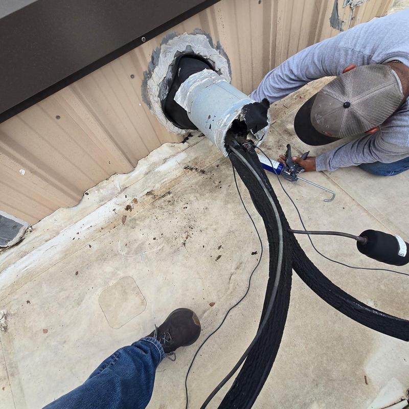 HVAC refrigerant lines sealing on commercial metal roof HVAC refrigerant lines sealing on commercial metal roof