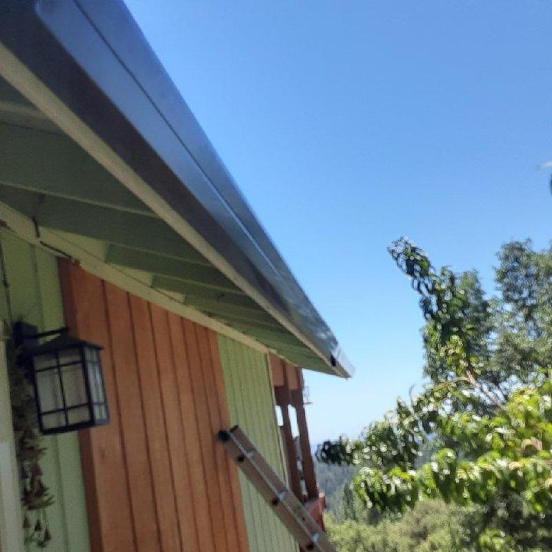 Seamless steel gutters with leaf blaster guards installation Seamless steel gutters with leaf blaster guards installation