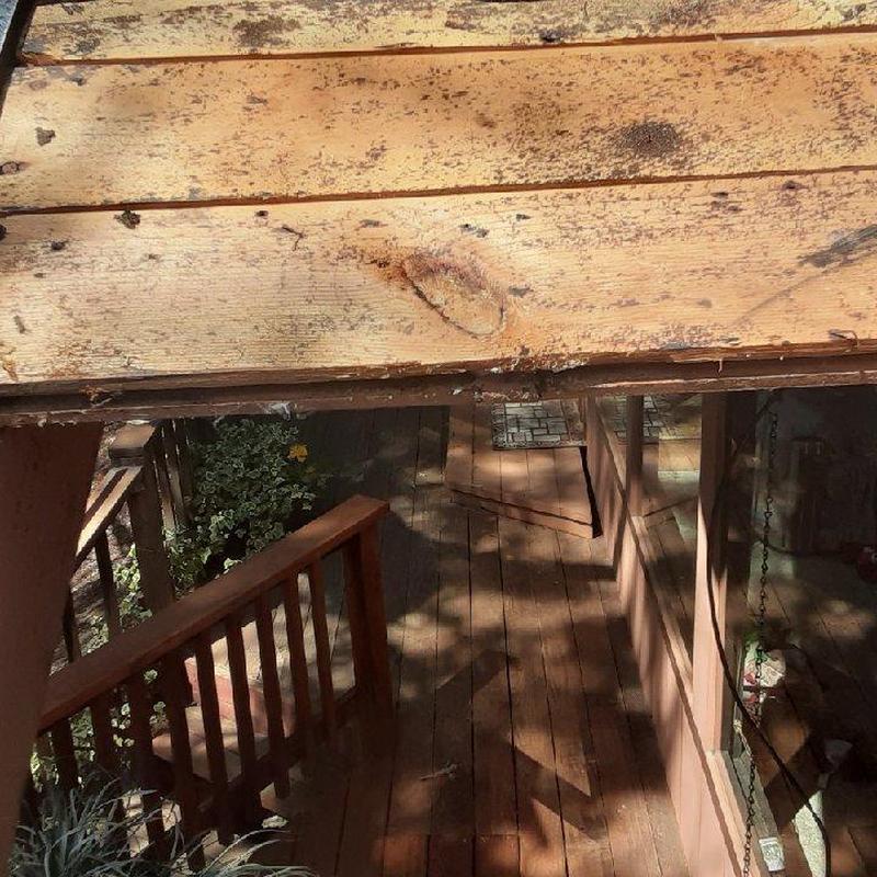 Wooden deck boards showing damage and wear