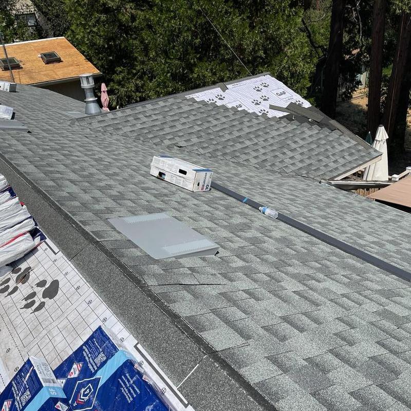 Asphalt shingle roof installation with vent flashing