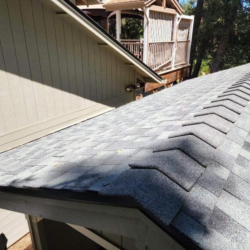 GAF asphalt shingle roof with ridge vent and gutters
