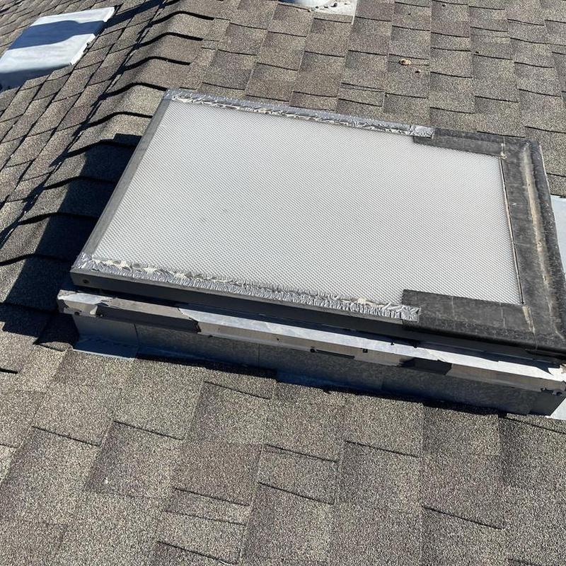 Velux skylight with asphalt shingle roof surrounding