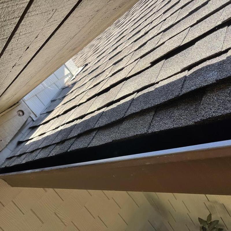 Asphalt roof shingles close-up on residential roof