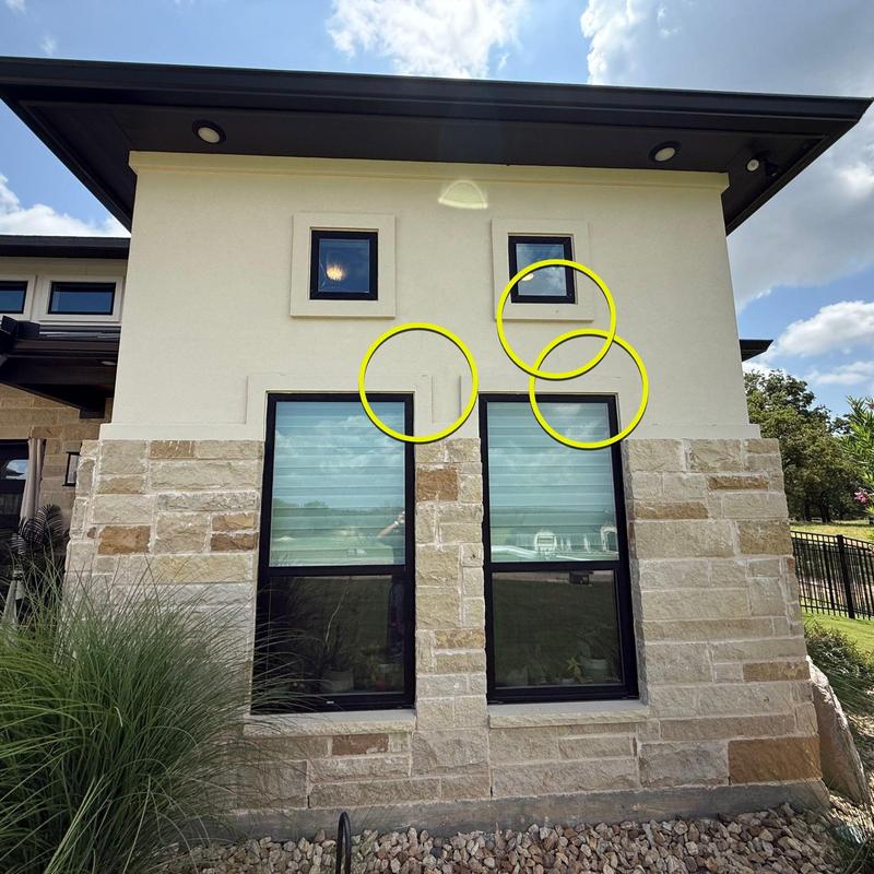 Stucco wall cracks around windows marked for repair Stucco wall cracks around windows marked for repair