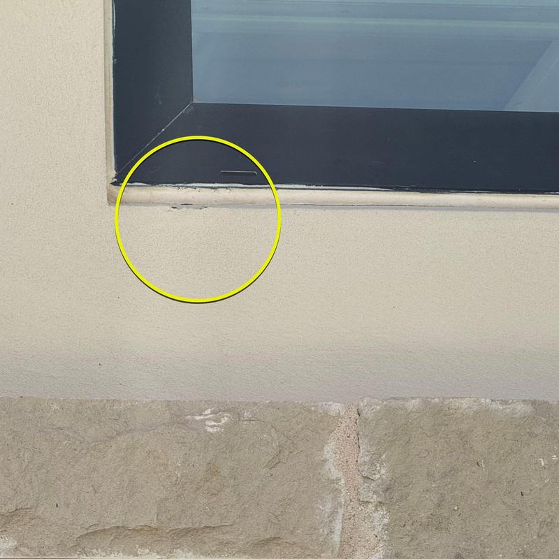 Stucco window frame with visible damage circled in yellow Stucco window frame with visible damage circled in yellow
