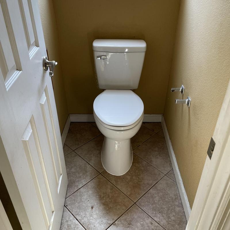 Toilet with new flange and secured drain assembly
