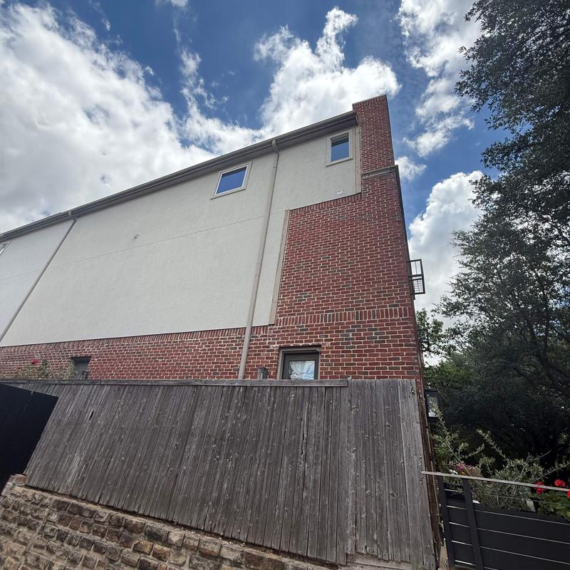 Concrete roofing repair on brick and stucco wall Concrete roofing repair on brick and stucco wall
