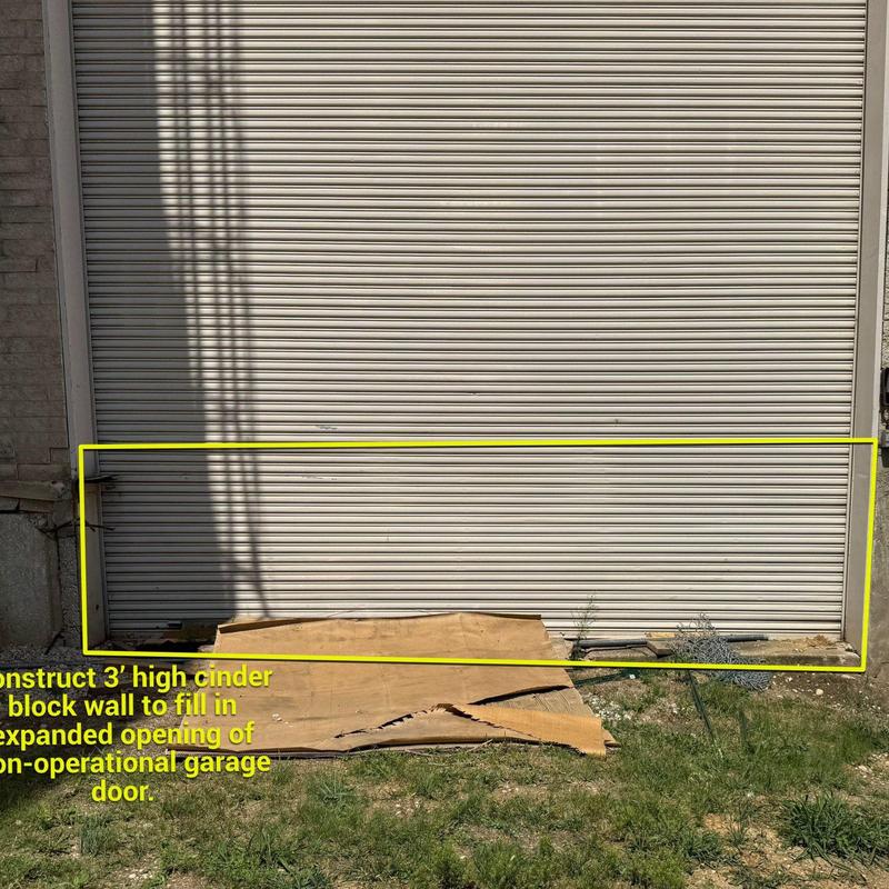 Garage door base cinder block wall construction area Garage door base cinder block wall construction area