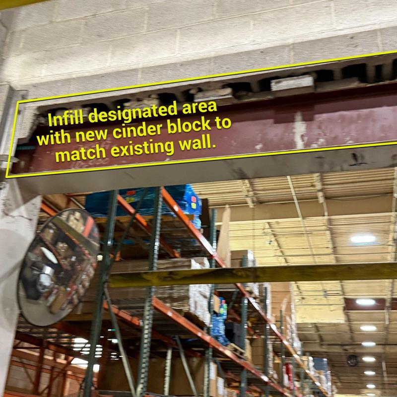 Cinder block wall infill in warehouse opening Cinder block wall infill in warehouse opening