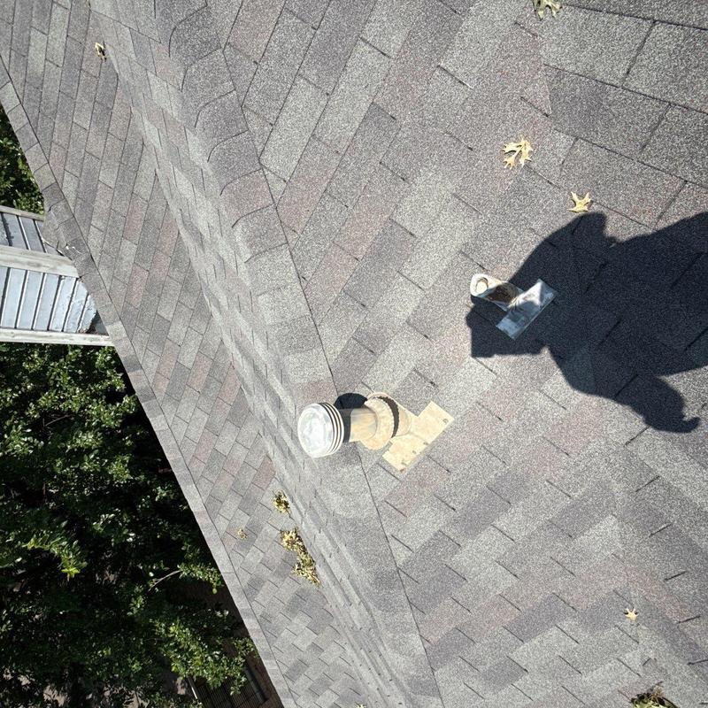 Roof shingles with vent pipe repair on residential roof Roof shingles with vent pipe repair on residential roof