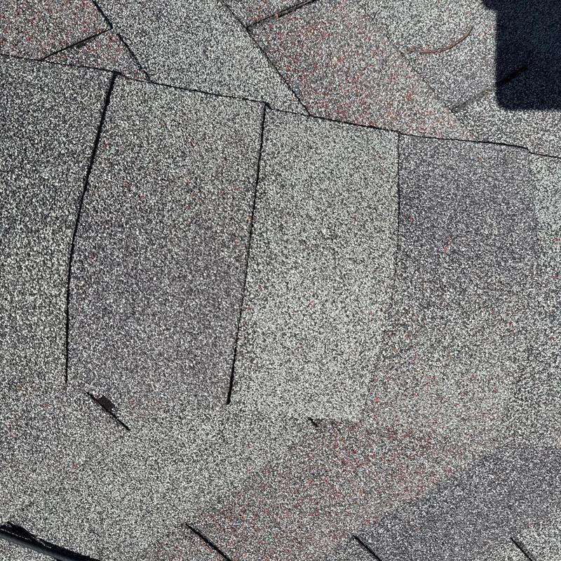 Asphalt roof shingles with hail damage repairs Asphalt roof shingles with hail damage repairs