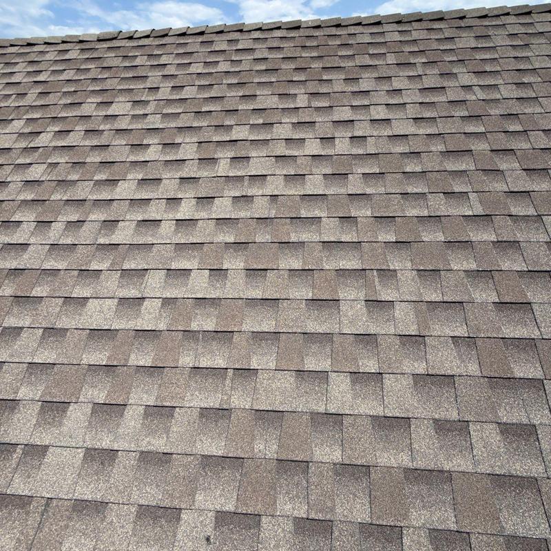 Asphalt shingle roof after wind and hail damage repair Asphalt shingle roof after wind and hail damage repair