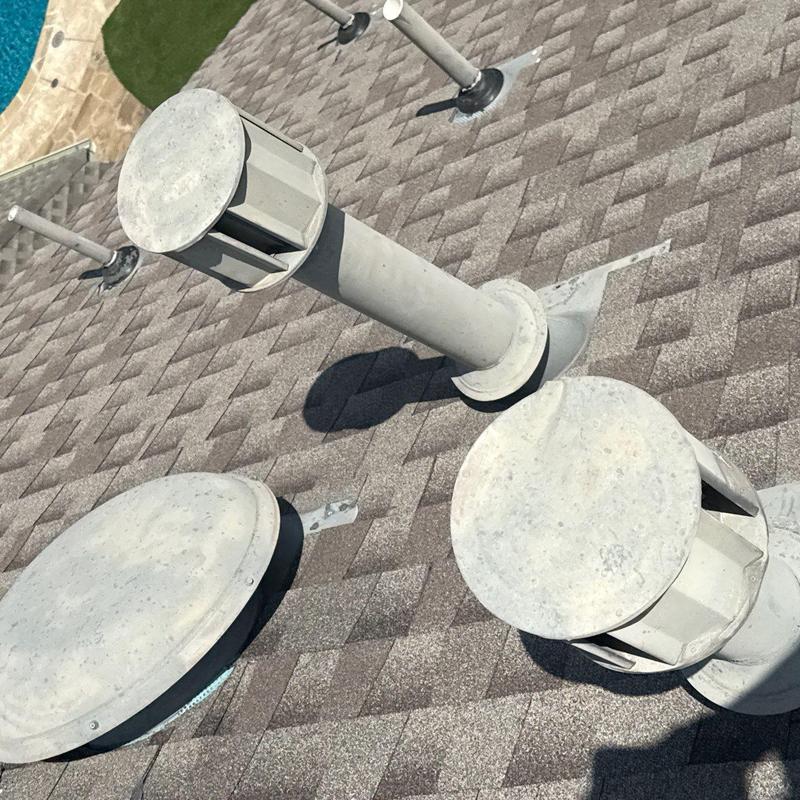 Roof vent pipes on shingle roof after storm repair Roof vent pipes on shingle roof after storm repair