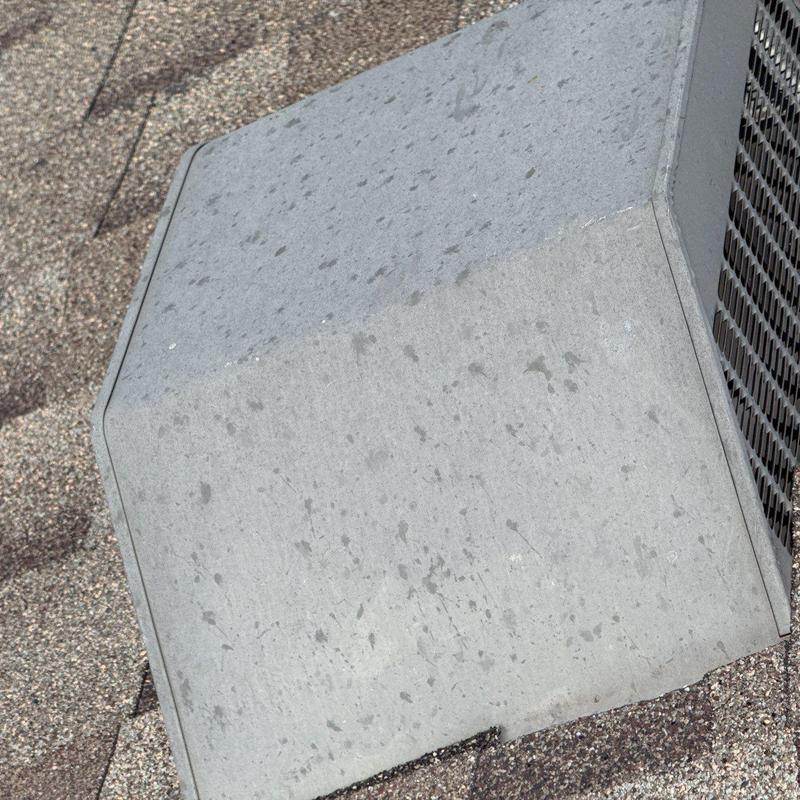 Metal roof vent on asphalt shingle roof with water spots Metal roof vent on asphalt shingle roof with water spots