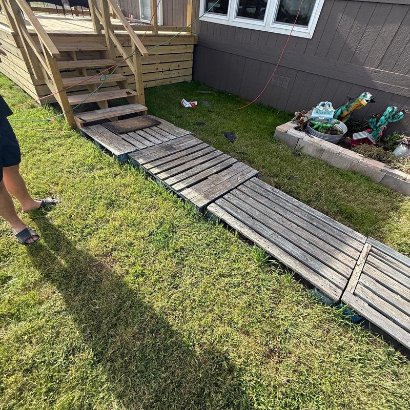 Wooden ramp with damaged and loose planks near stairs Wooden ramp with damaged and loose planks near stairs