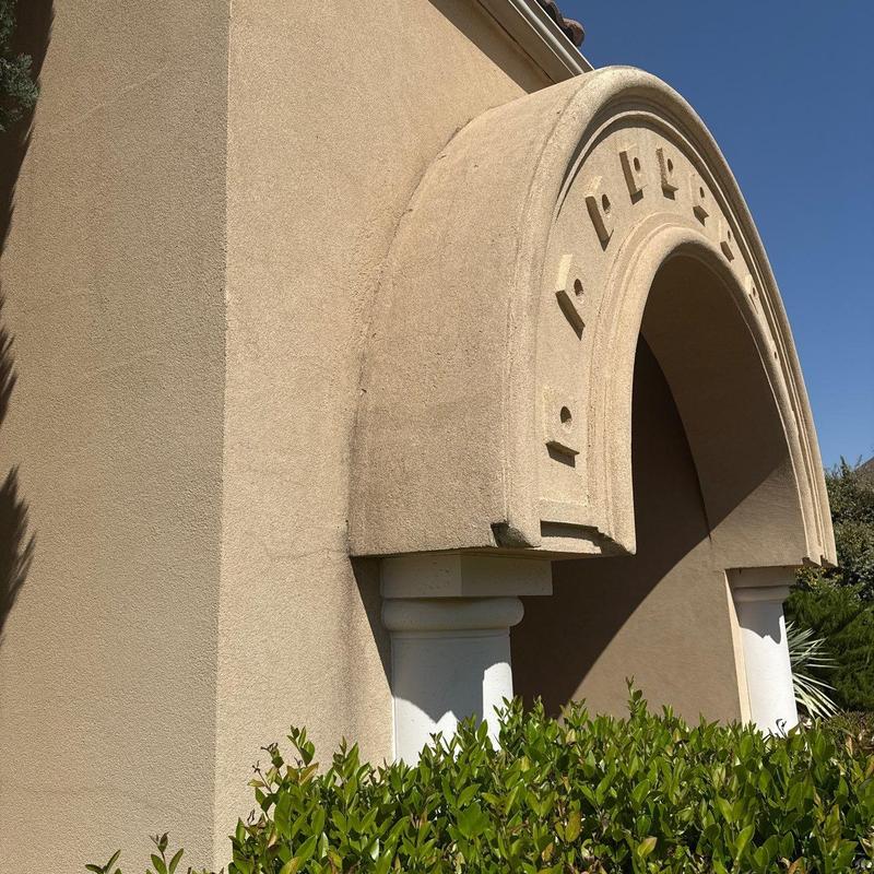 Stucco archway restoration with textured finish Stucco archway restoration with textured finish