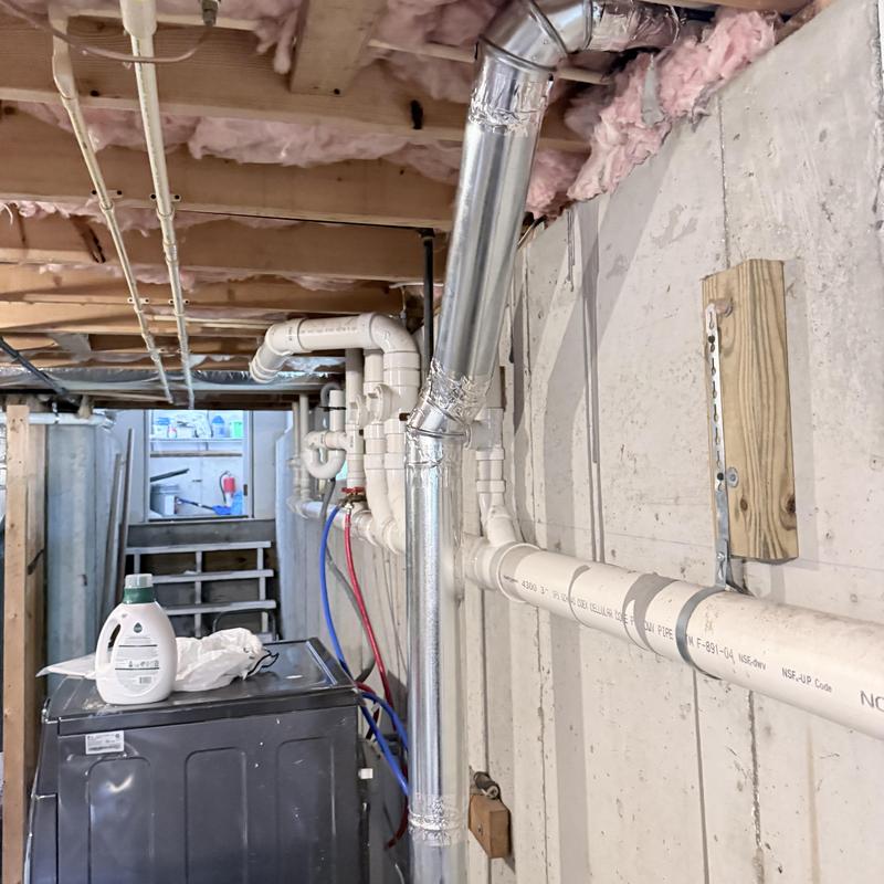 Dryer vent and emergency shut-off piping in basement Dryer vent and emergency shut-off piping in basement