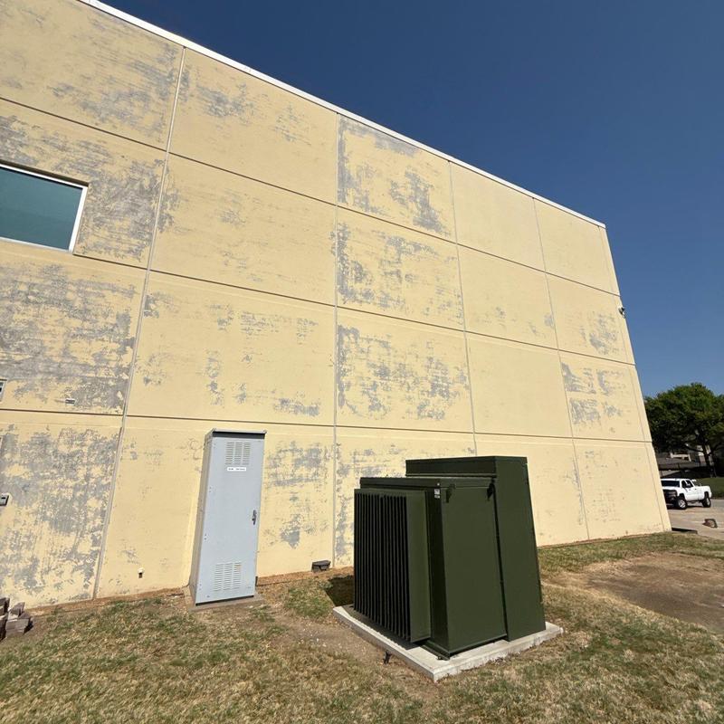 Concrete wall exterior with weathered paint patches Concrete wall exterior with weathered paint patches