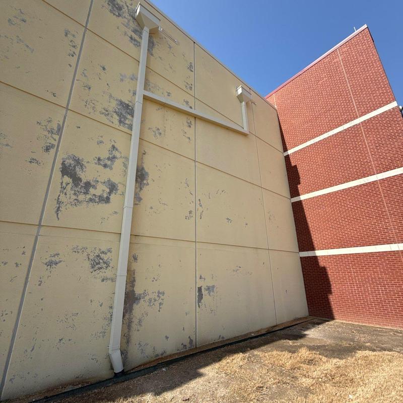 Stucco wall exterior with weathered damage spots Stucco wall exterior with weathered damage spots