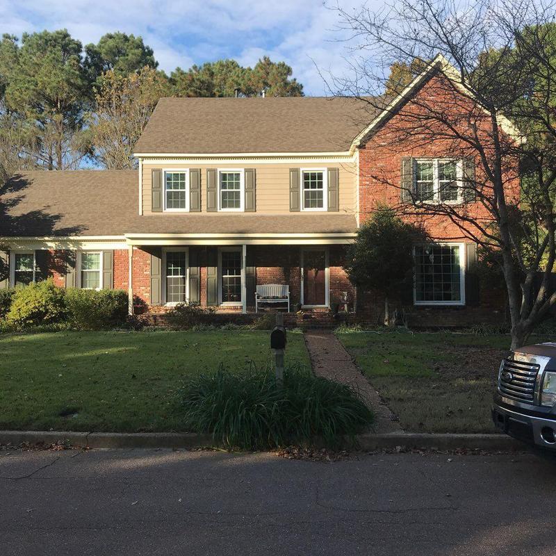 Shingle roof replacement on suburban two-story home
