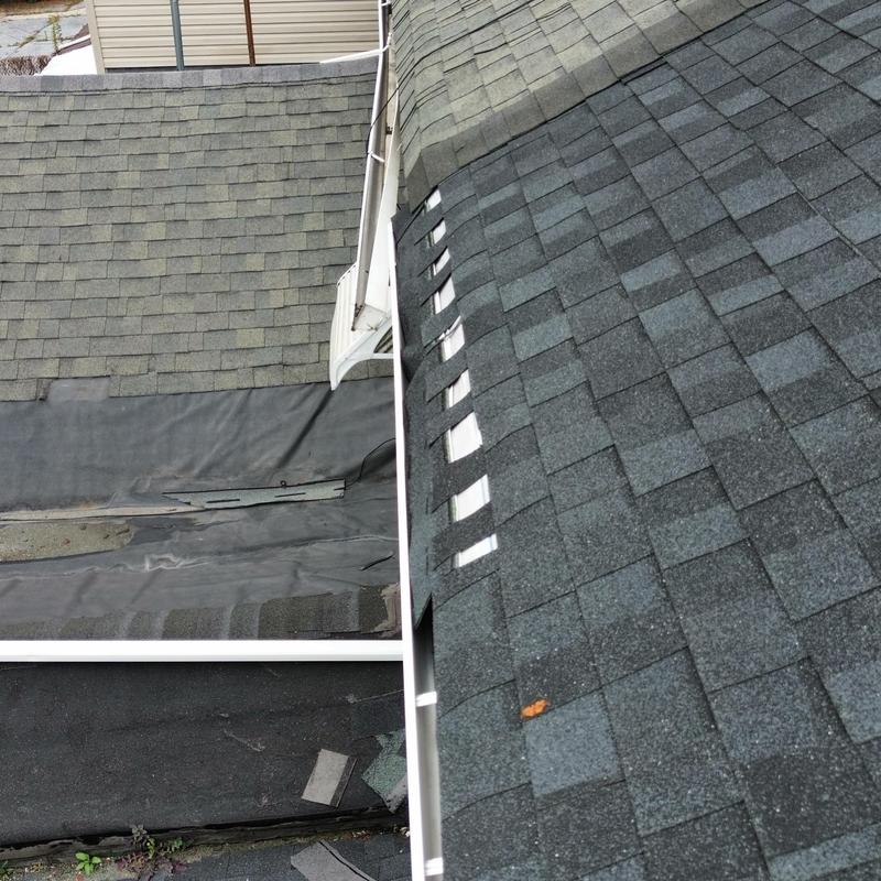 Asphalt shingle roof with damaged flashing and missing shingles Asphalt shingle roof with damaged flashing and missing shingles