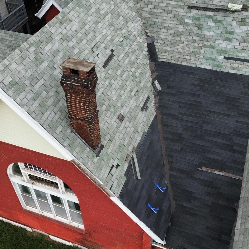 Asphalt shingles roof with wind damage and patch repairs Asphalt shingles roof with wind damage and patch repairs