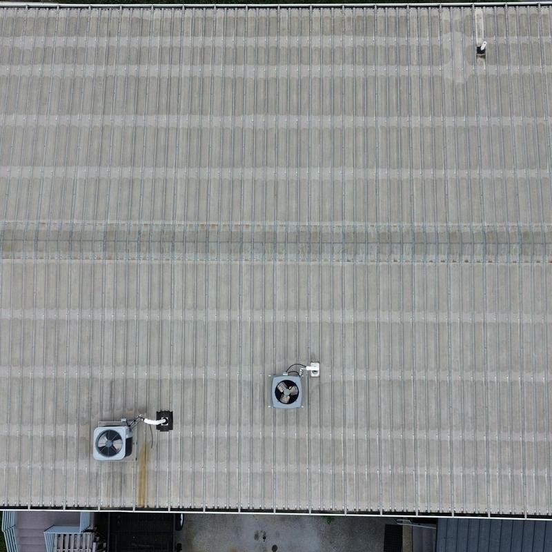 Commercial metal roof with ventilation fans and grommets Commercial metal roof with ventilation fans and grommets