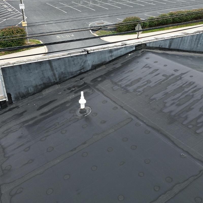 EPDM commercial roof surface with vent pipe EPDM commercial roof surface with vent pipe