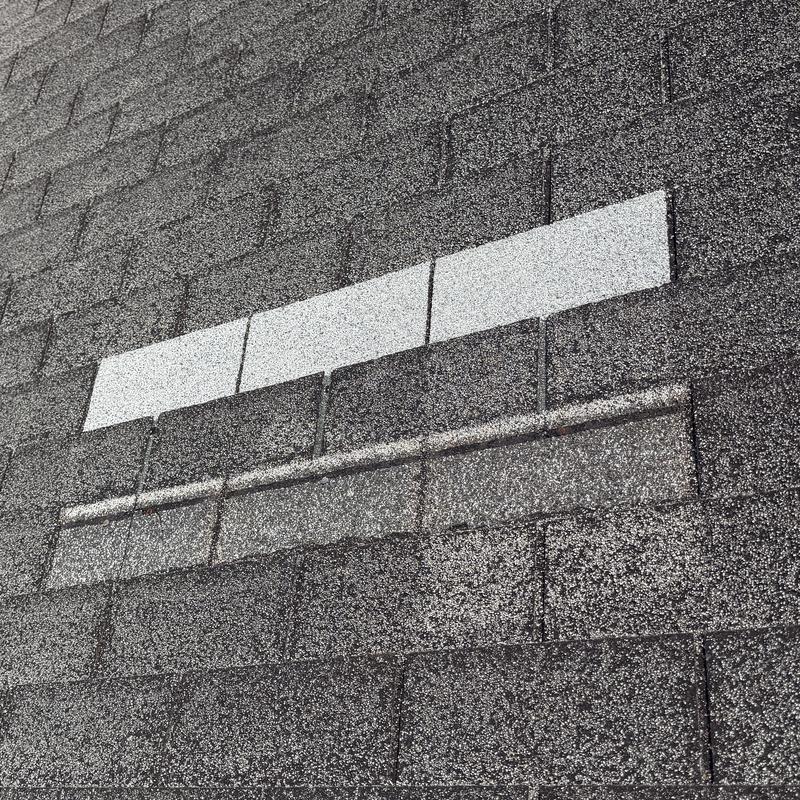 Asphalt shingles with granule loss and damage notice Asphalt shingles with granule loss and damage notice