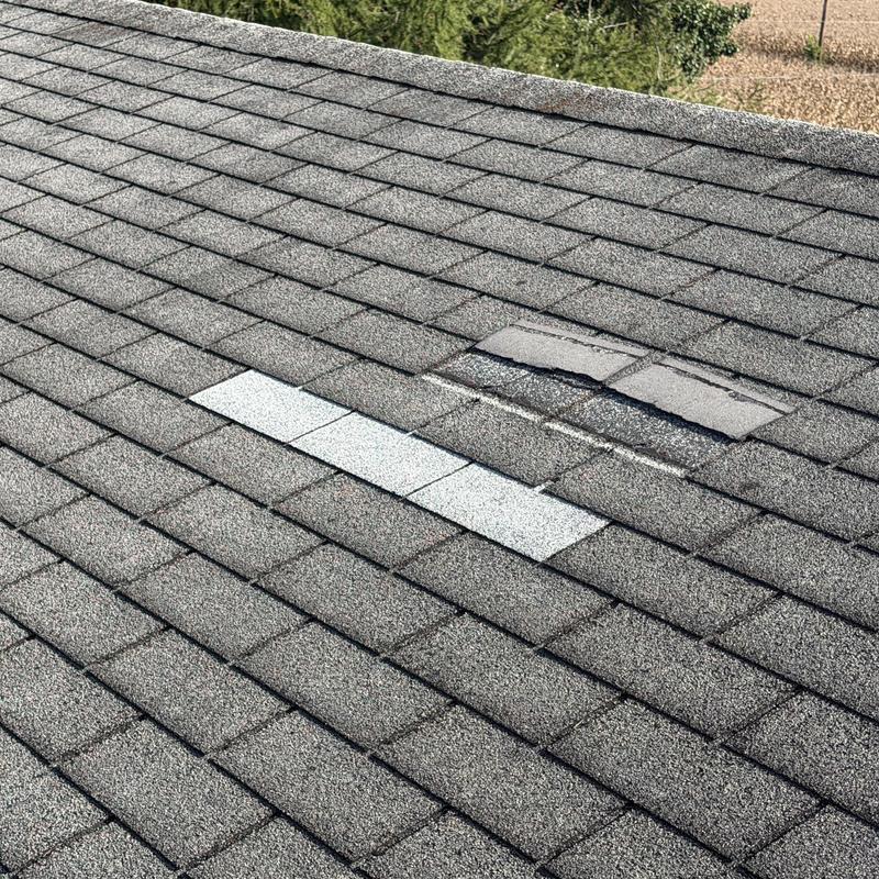 Roof shingles with heavy granule loss and patch repairs Roof shingles with heavy granule loss and patch repairs