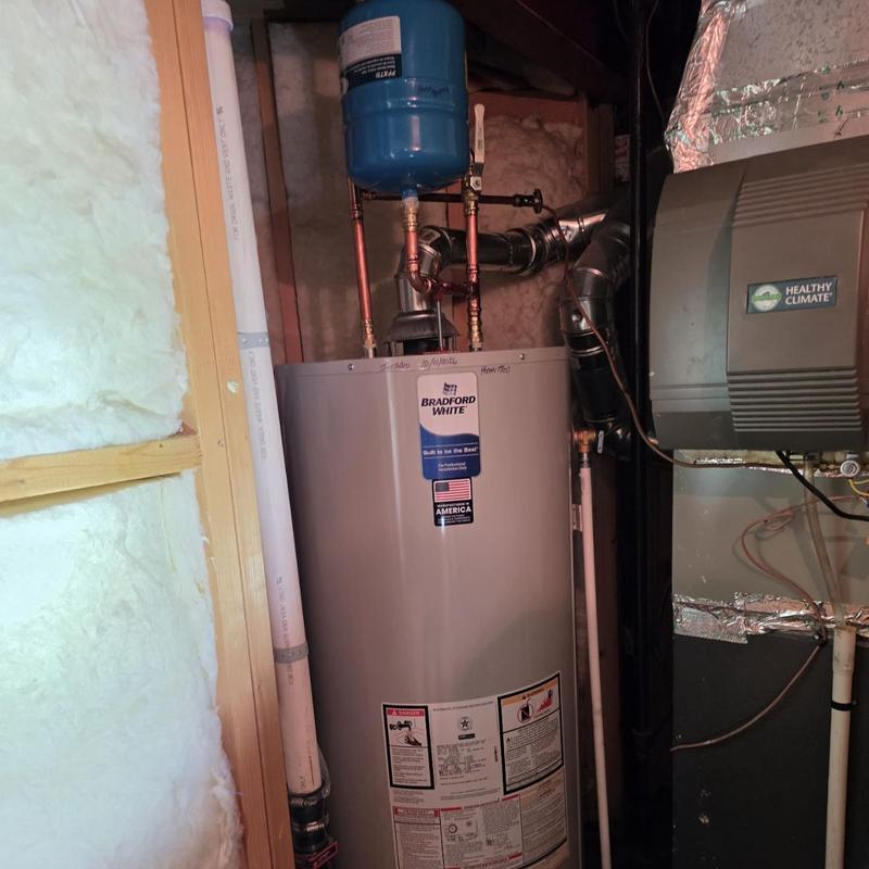 Water heater with expansion tank installation in basement