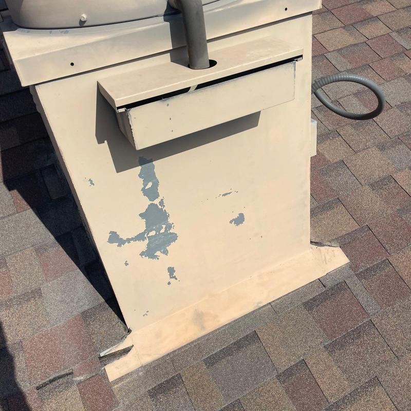 Roof vent flashing with paint peeling and wear Roof vent flashing with paint peeling and wear