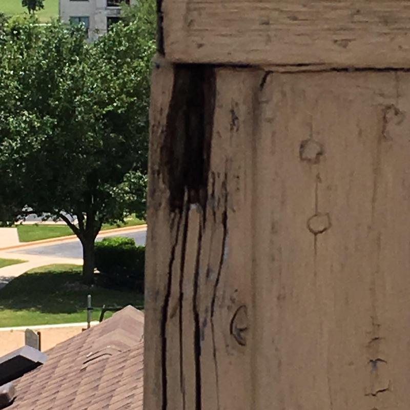 Wooden post water damage and stain on porch railing Wooden post water damage and stain on porch railing