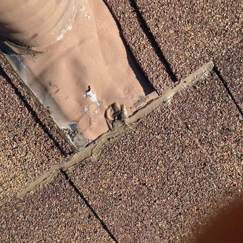 Shingle roof flashing with sealant patch on vent pipe Shingle roof flashing with sealant patch on vent pipe
