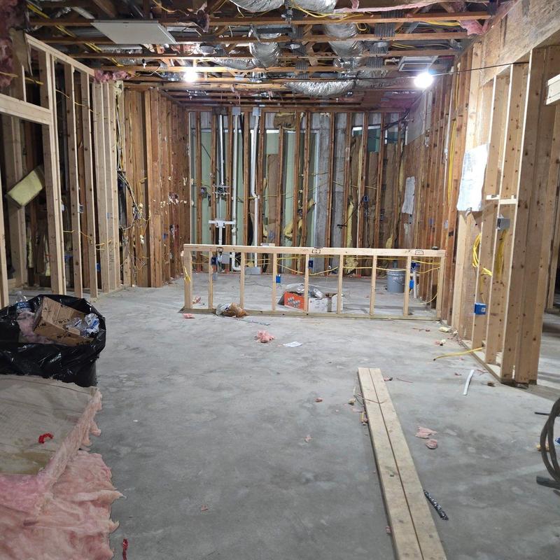 Wood framing interior construction with exposed studs and wiring Wood framing interior construction with exposed studs and wiring